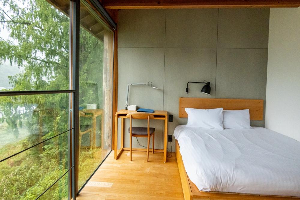 Front side of the room is all window, perfect view of the mountains and Akui river is right there